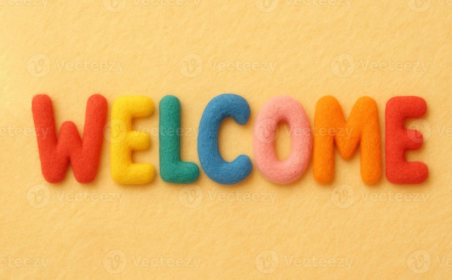 WELCOME word on yellow background composed from colorful felt letters photo
