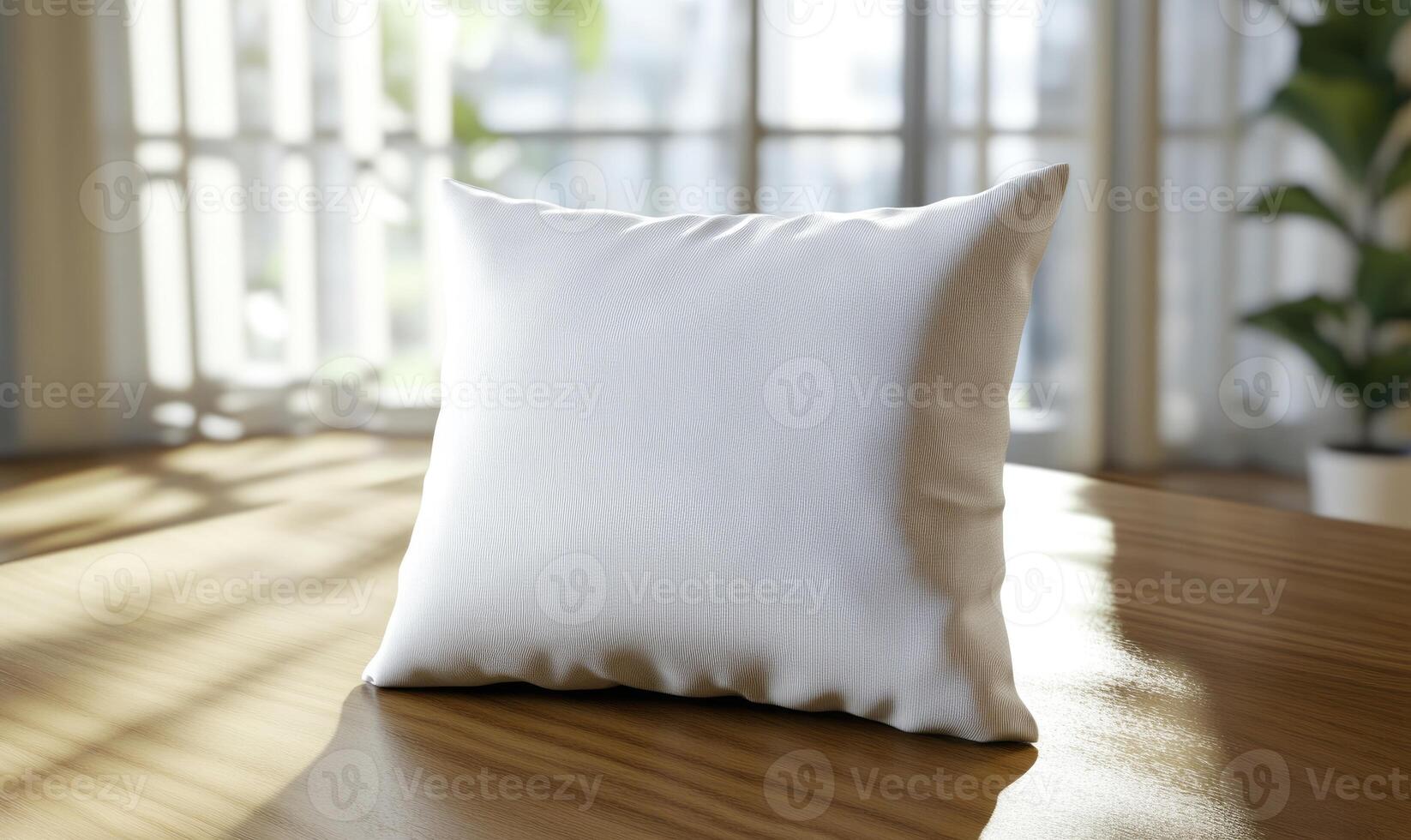 white pillow on wooden table in front of window photo