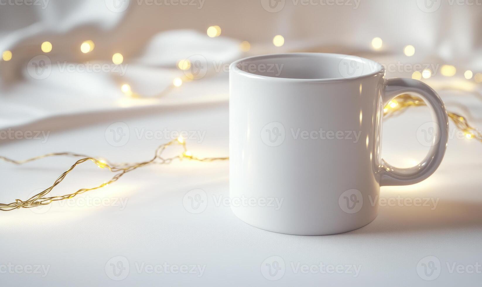 a white mug with a christmas light string around photo