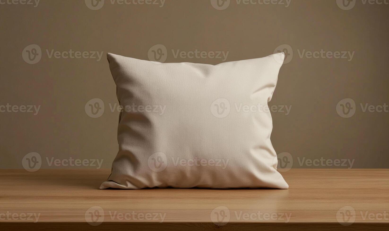 a pillow on a wooden table with a blank background photo