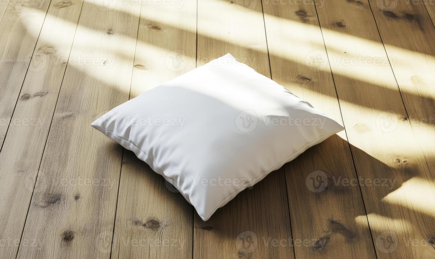 white pillow on wooden floor with sunlight photo