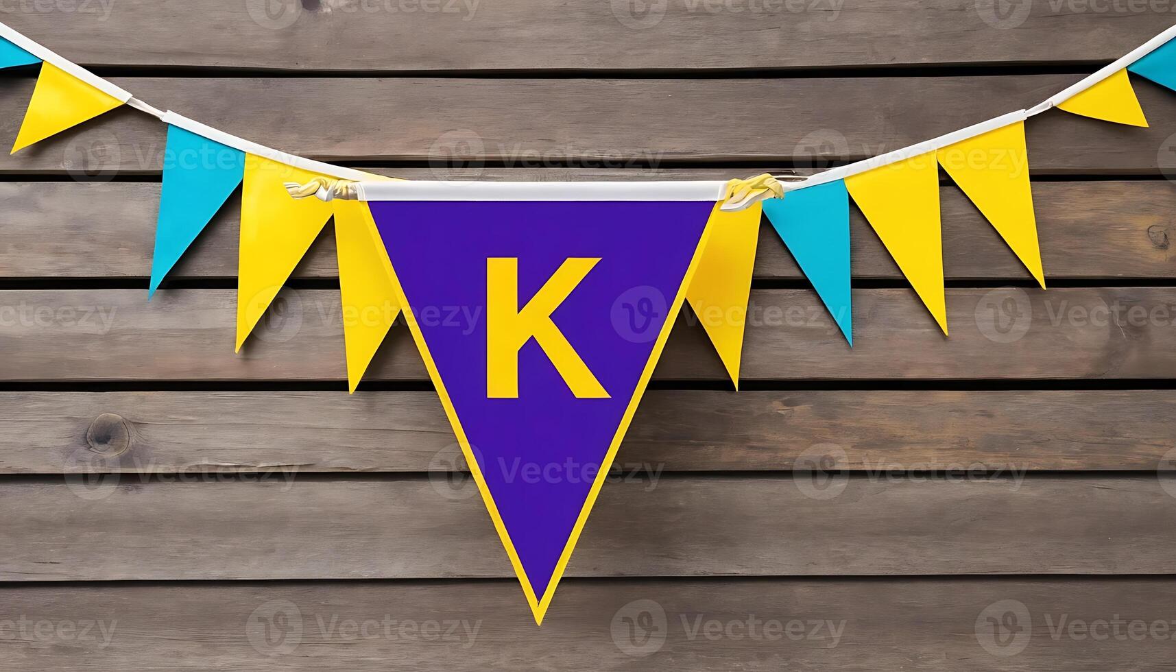 Colorful Pennant Banner Decoration Featuring Letter K on Wooden Wall photo