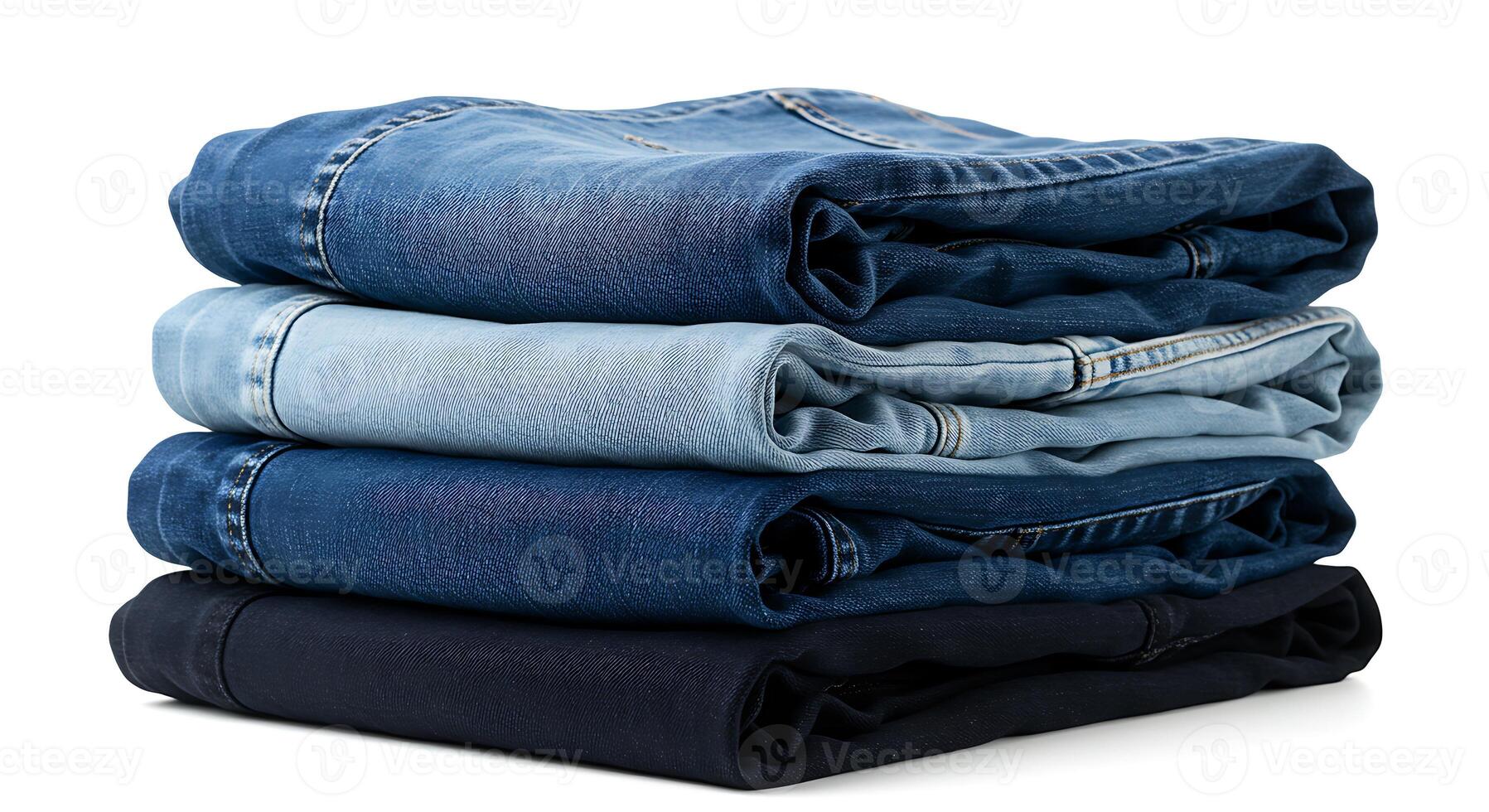 Stack of Folded Jeans in Various Blue Shades on White photo