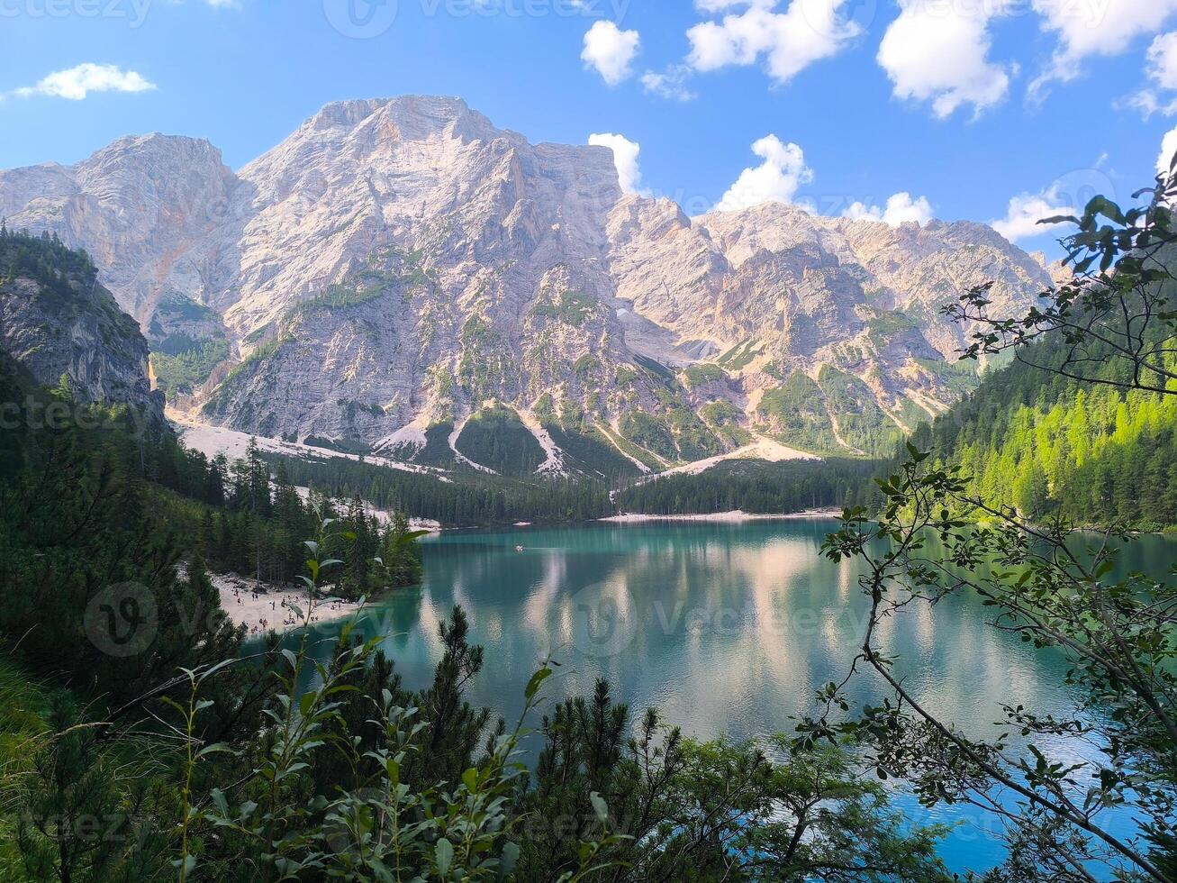 Majestic mountains reflecting on the tranquil waters of a serene lake in the heart of nature's beauty photo