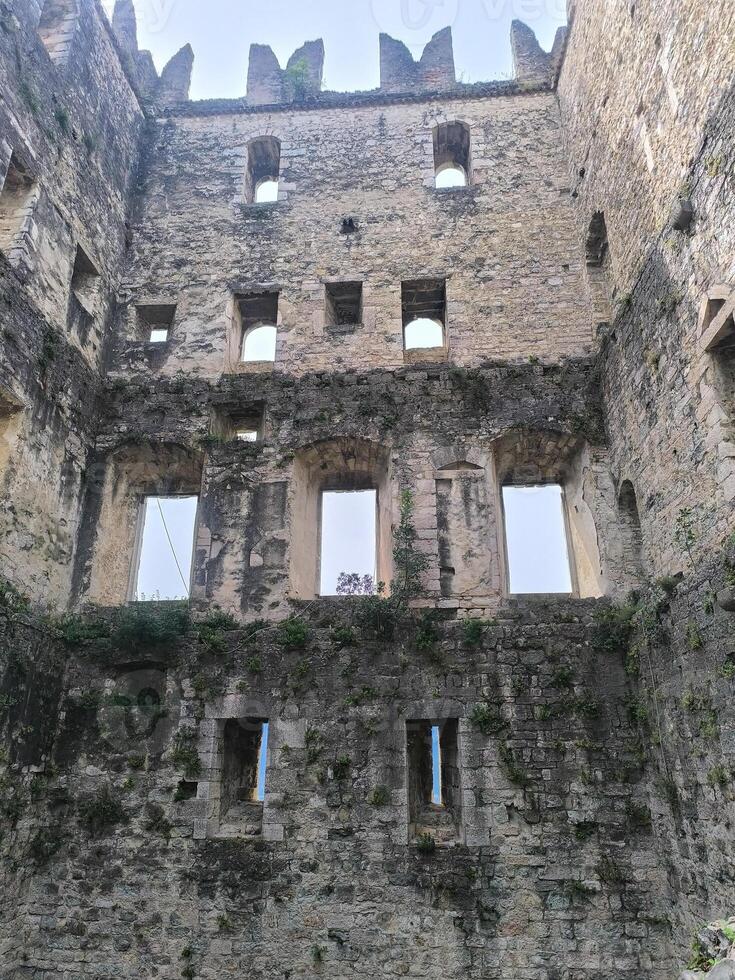 Exploring ancient stone ruins surrounded by nature at the heart of a historical site photo