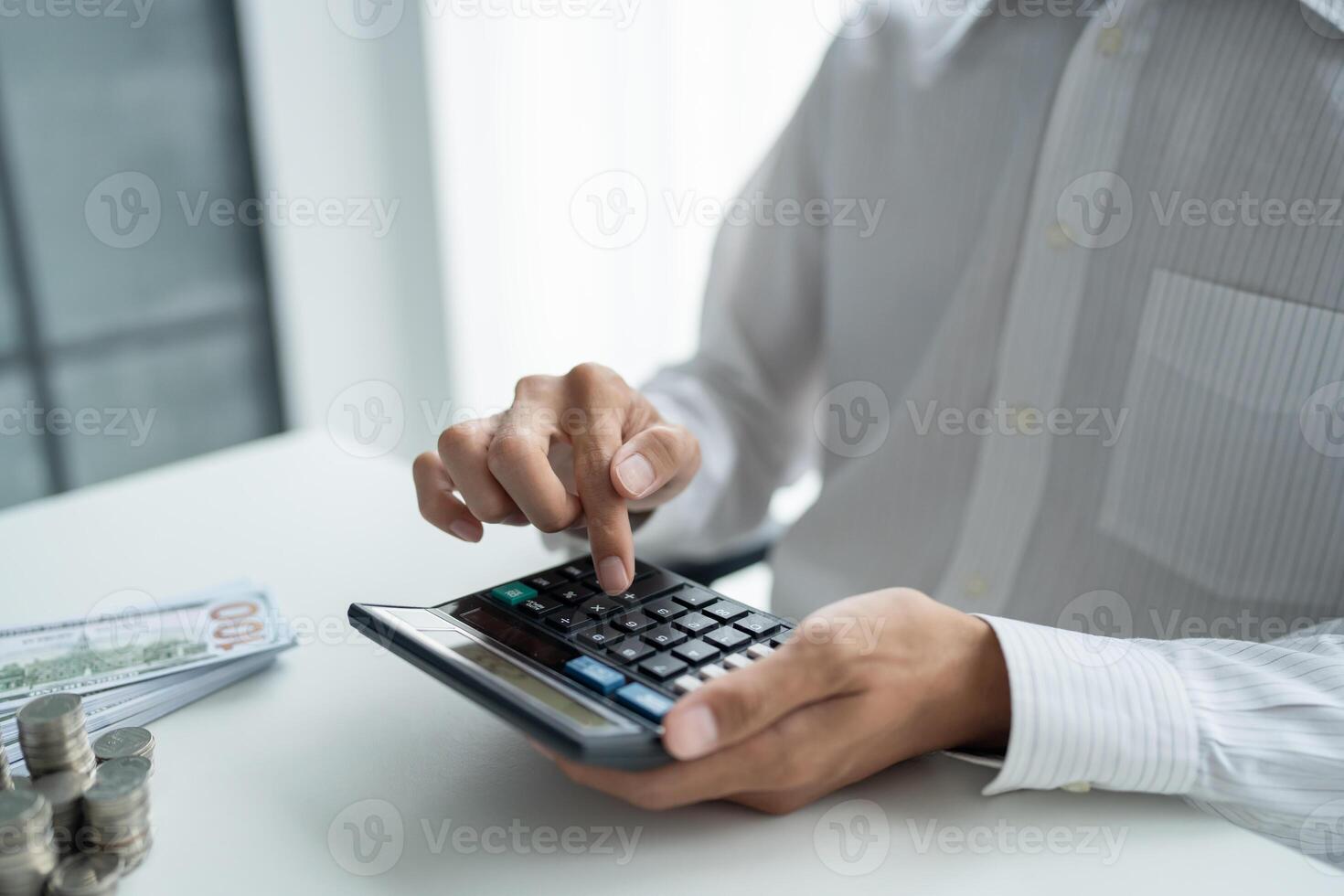 Businessman checking bills taxes bank account balance and calculating annual financial statements of company. Accounting Audit Concept photo