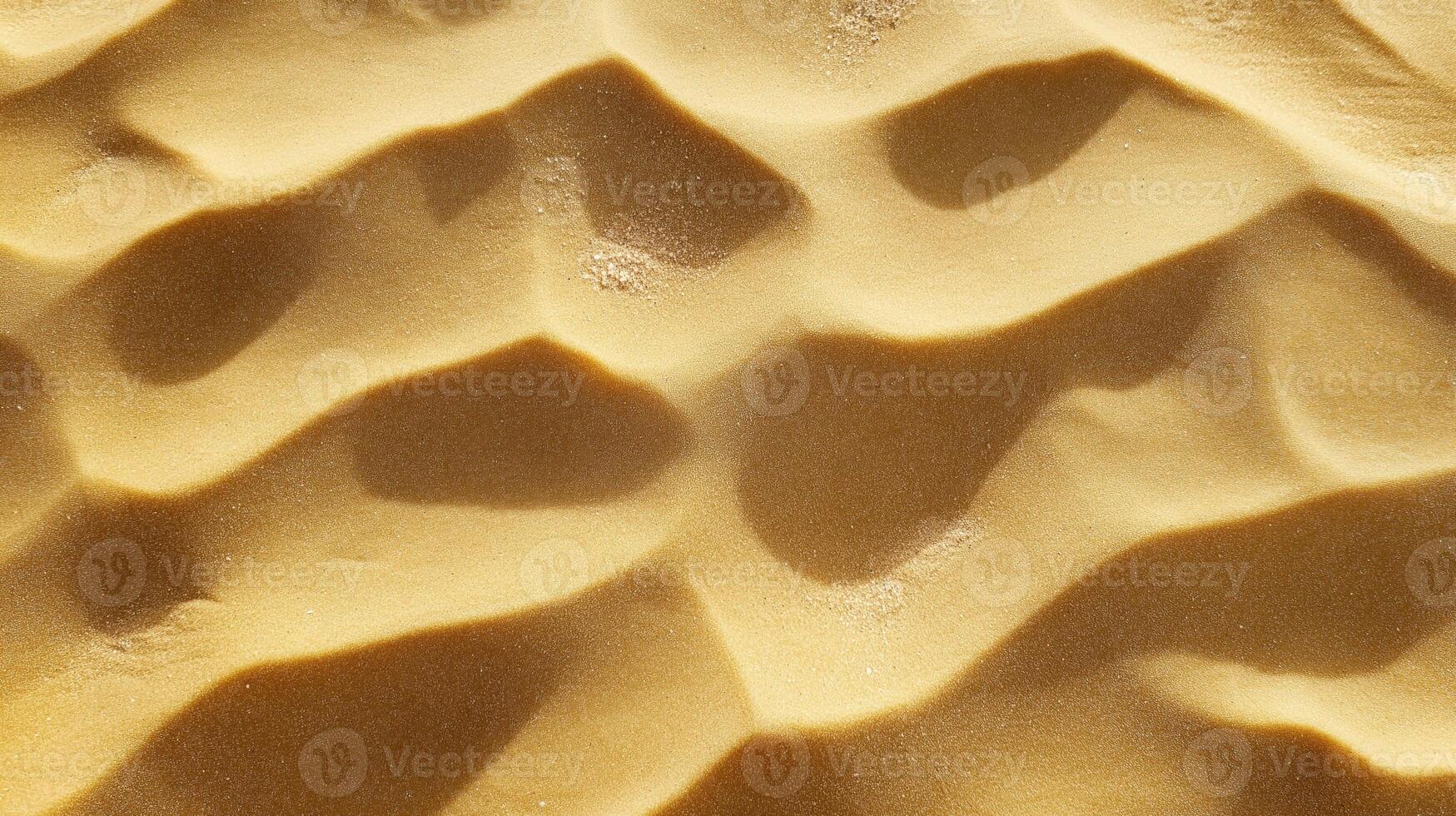 Close-up of smooth sand dunes with rippled patterns and soft shadows in desert landscape photo
