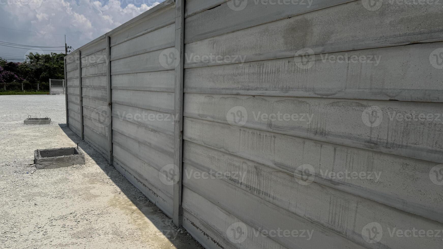 Architectural Concrete Wall A solid, textured, and expansive concrete wall with horizontal lines, captured in sharp detail, offering a sense of structured protection and minimalist style. photo