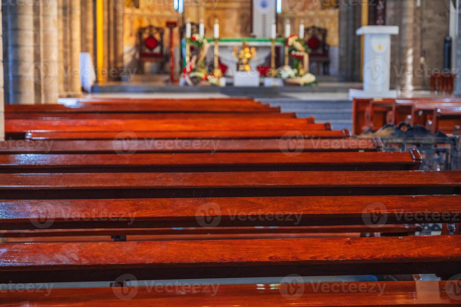 Wooden benches inside Catholic Cathedral Stone Church in Nha Trang in Vietnam photo
