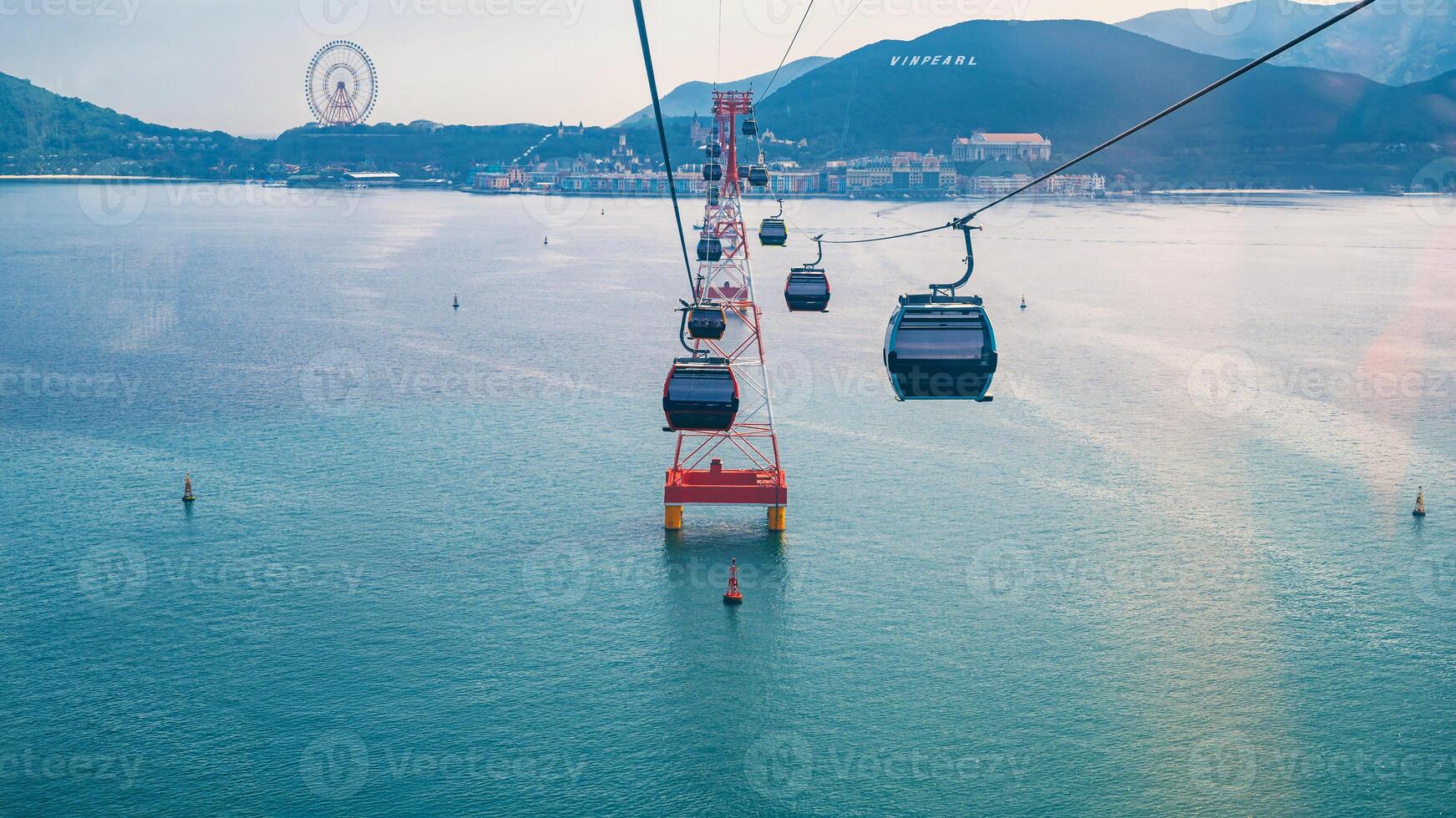 cable car cabins on cableway over sea to Hon Tre Island at VinWonders Vinpearl Amusement Park in Nha Trang in Vietnam photo