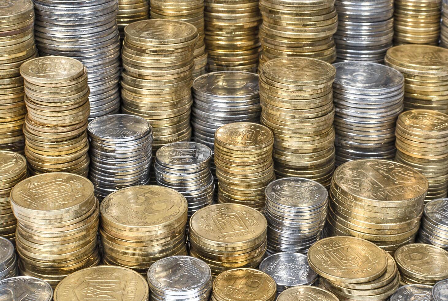Piles of Ukrainian coins background photo