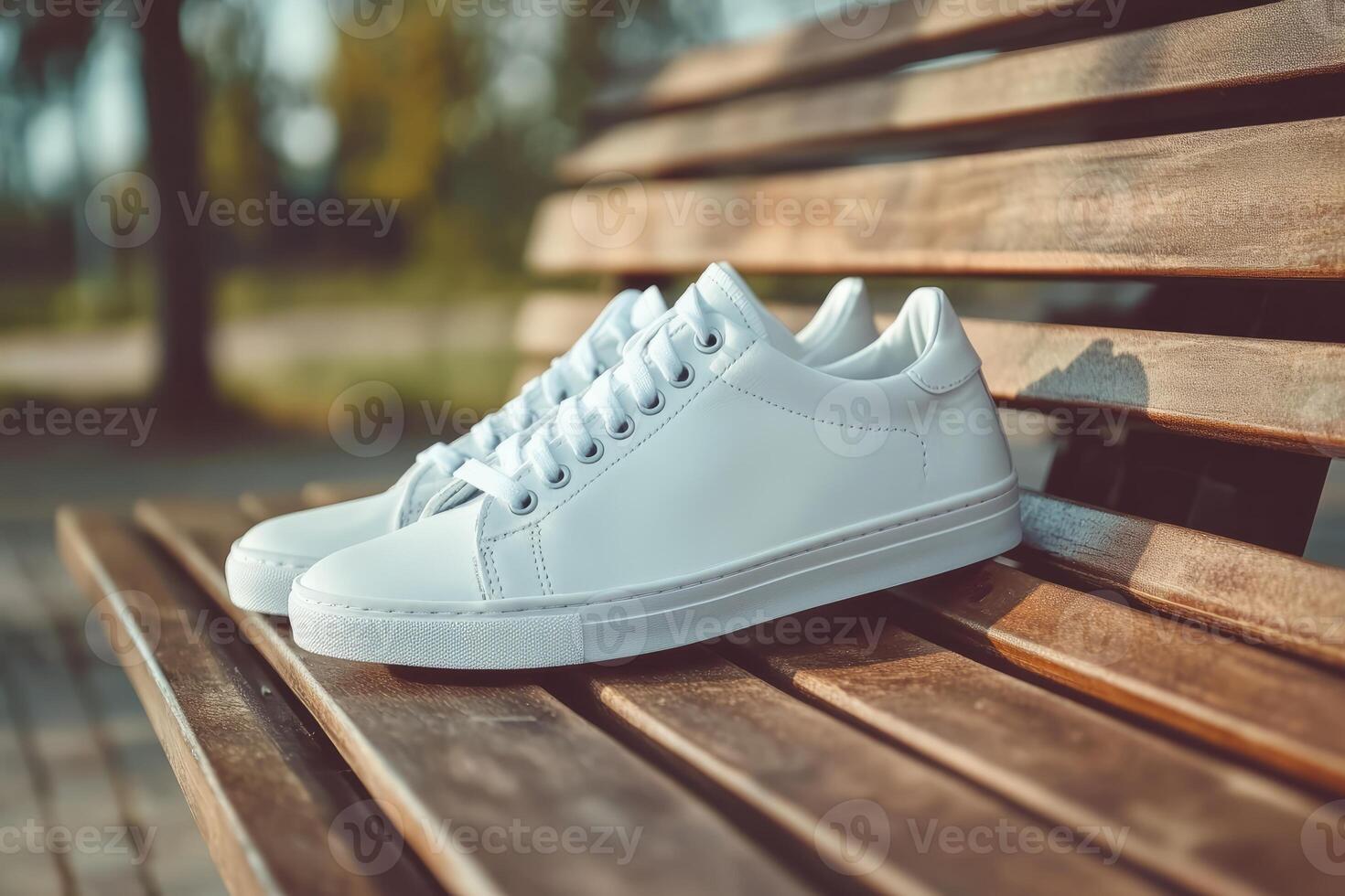 White sneakers on a wooden bench photo