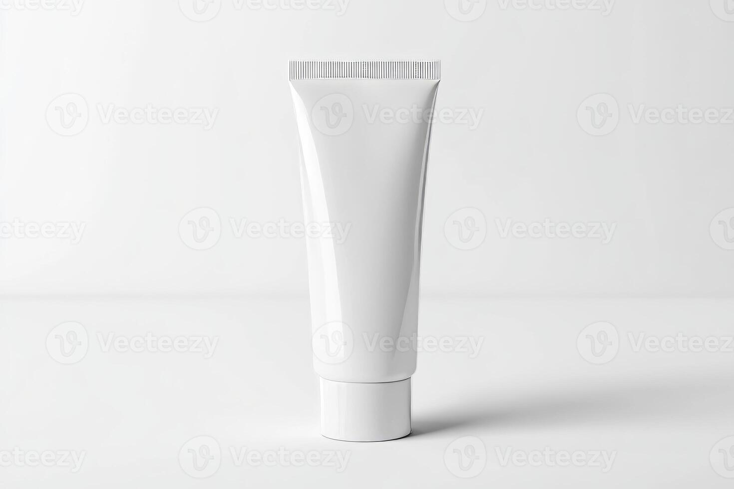 A tube of white cream on a white surface photo