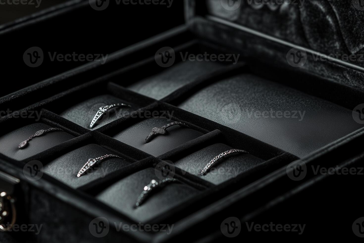 Jewelry boxes display elegant necklaces and rings arranged neatly for showcase at an upscale event photo