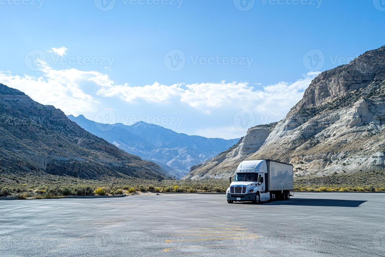 truck parked in a parking lot in a mountainous area photo