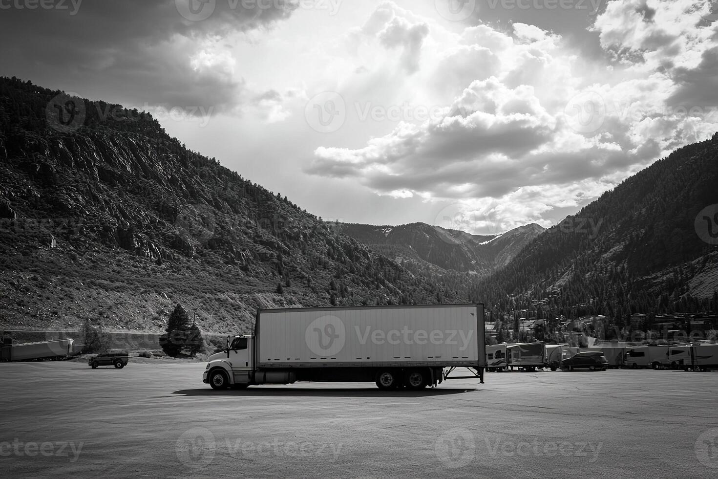 monochrome image big lorry parked at truck stop in mountainous area photo