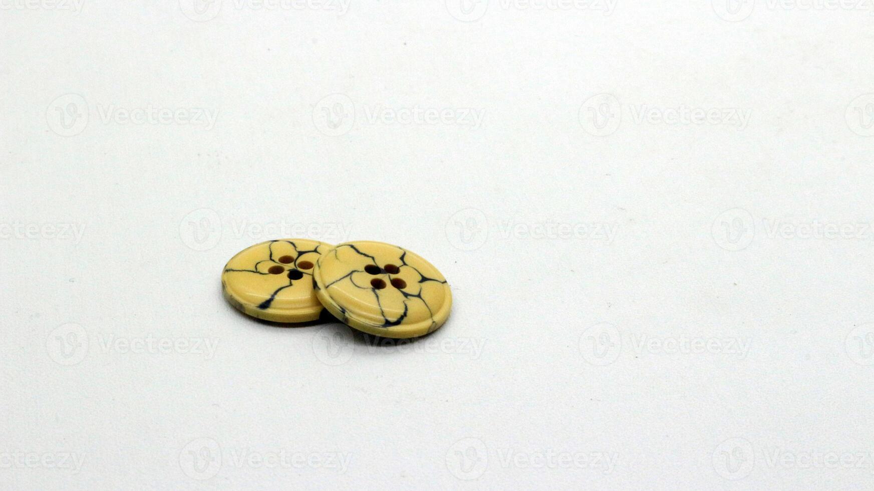 4 Brown clothing buttons isolated photo