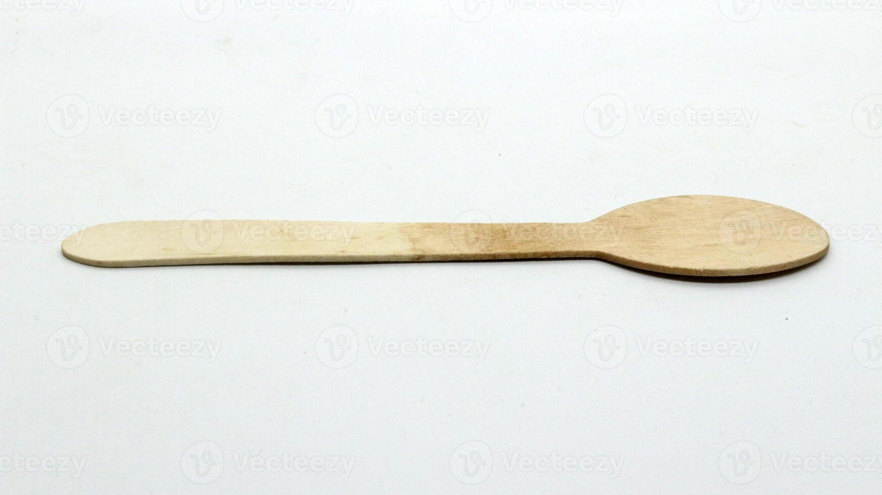 12. Wooden spoon and fork on white background photo