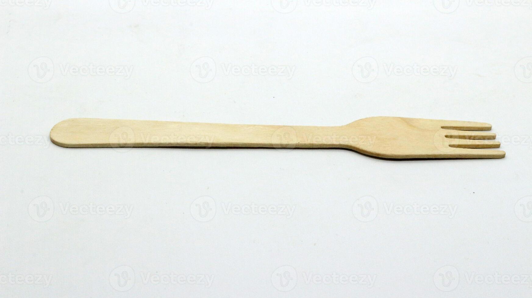 2. Wooden spoon and fork on white background photo