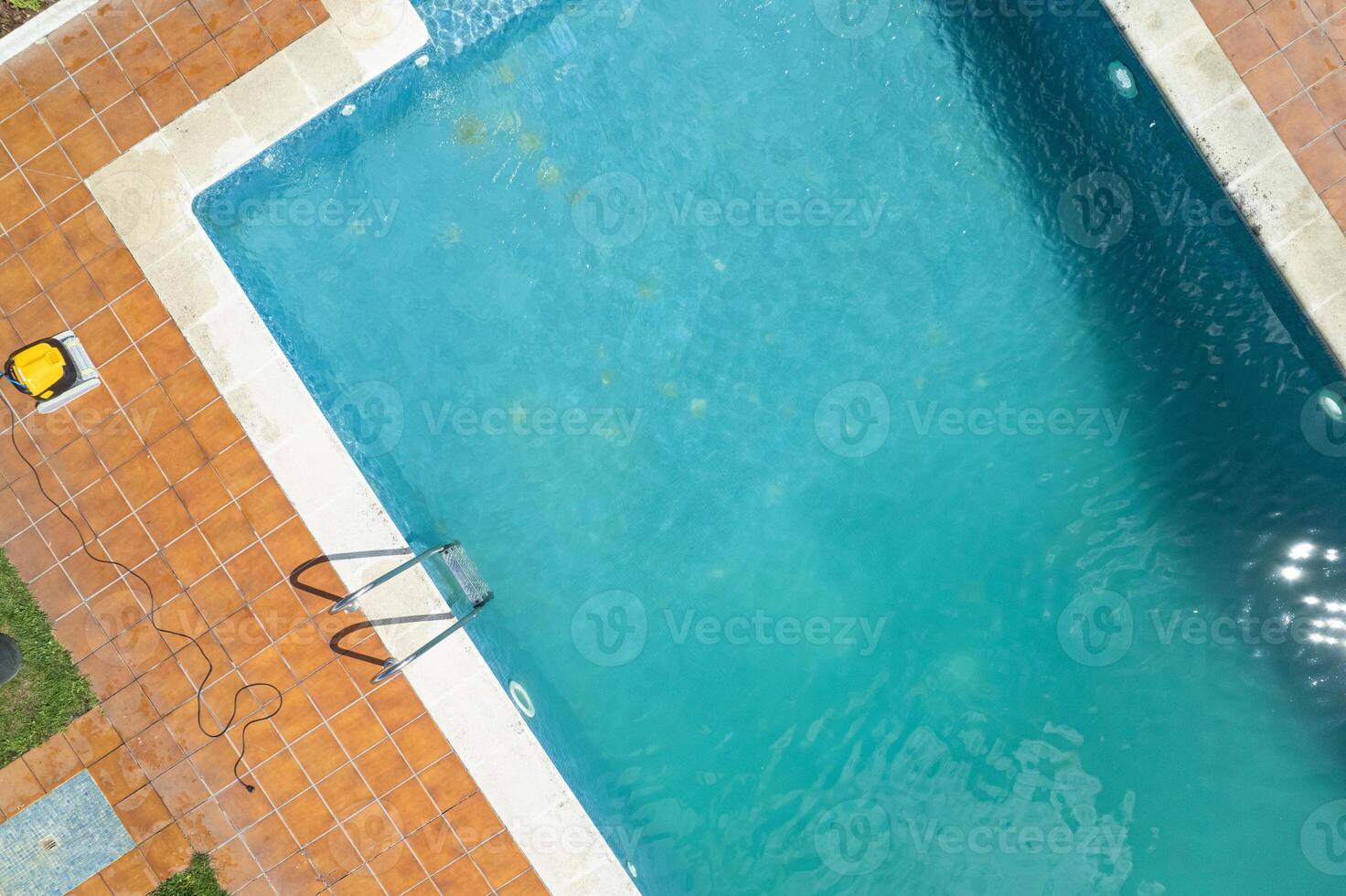 top-down aerial view of a rectangular swimming pool, aerial drone view. Concept of summer relax photo