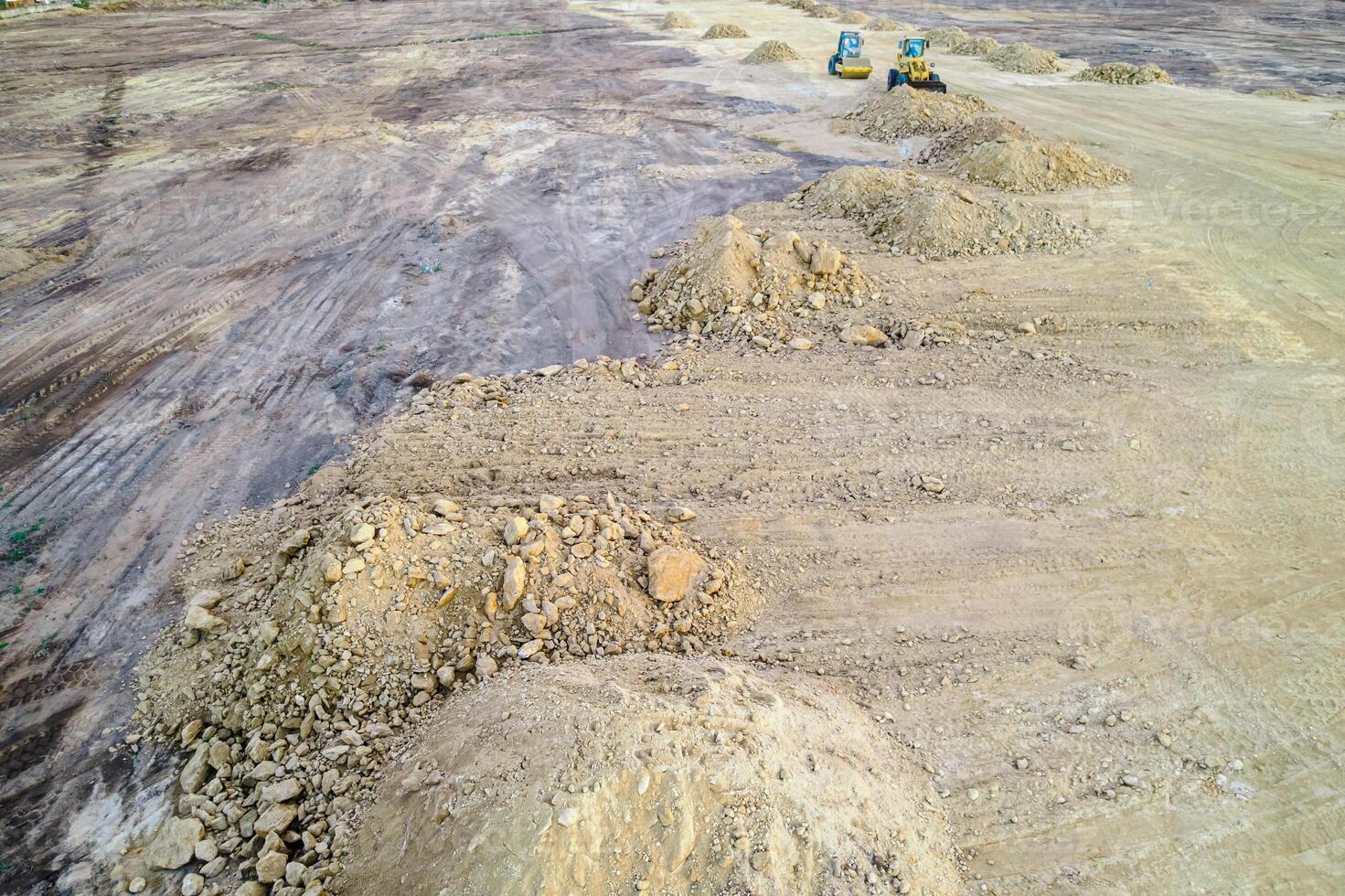 aerial view of a construction site with excavators abstract drone view of earth moving and ground texture photo