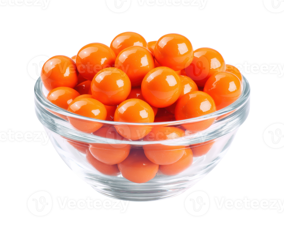 Bright orange candy spheres in a glass bowl for dessert display png