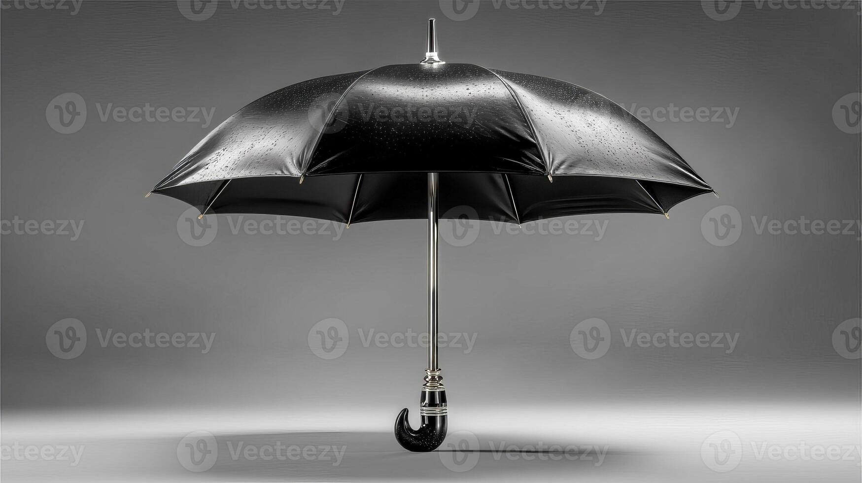 Smooth black umbrella placed vertically on clean isolated background photo