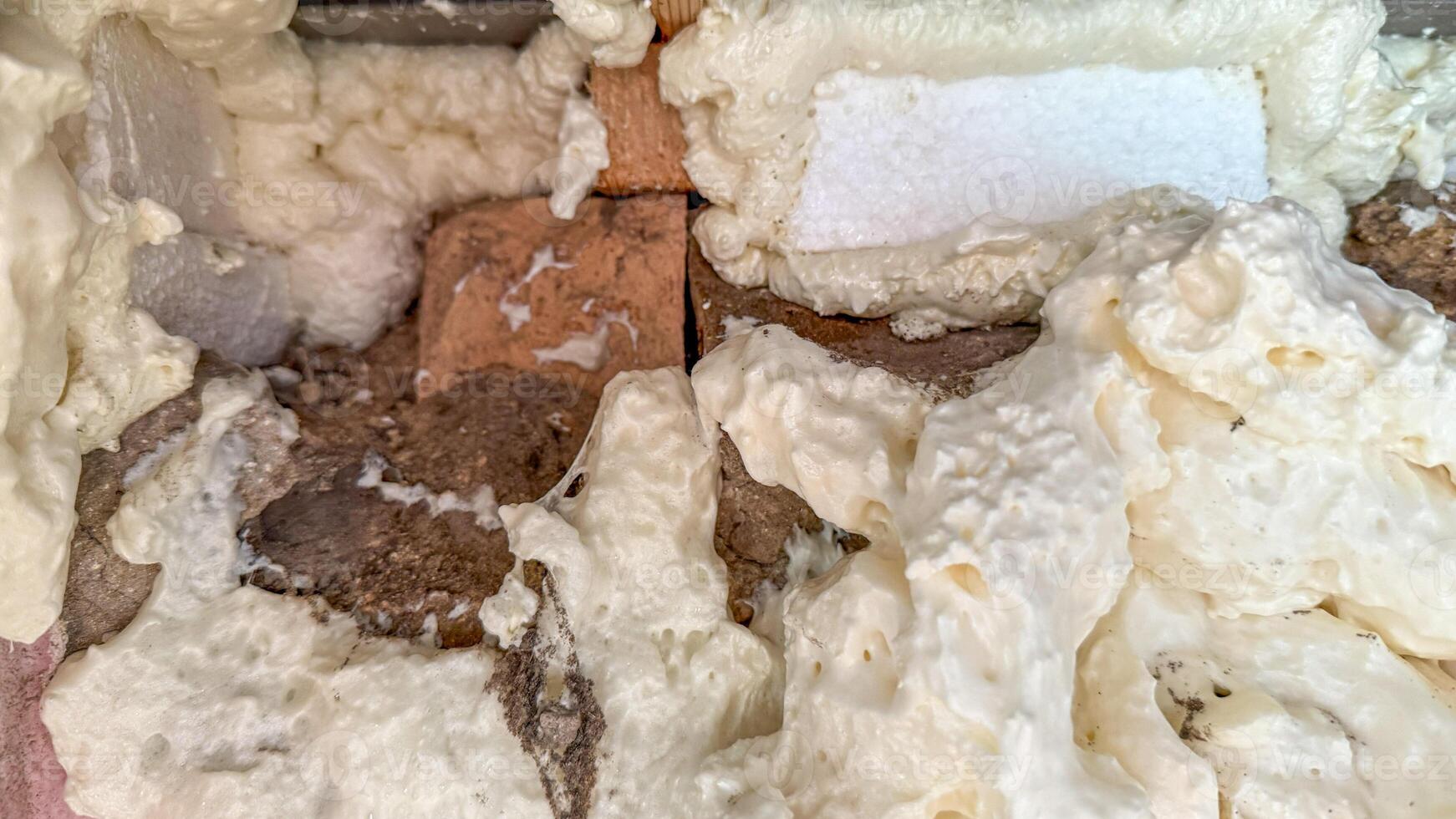 Foamy insulation layers, frothy urban cocoon embracing bricks, quirky construction aesthetic, National Home Improvement Month, structural whimsy photo