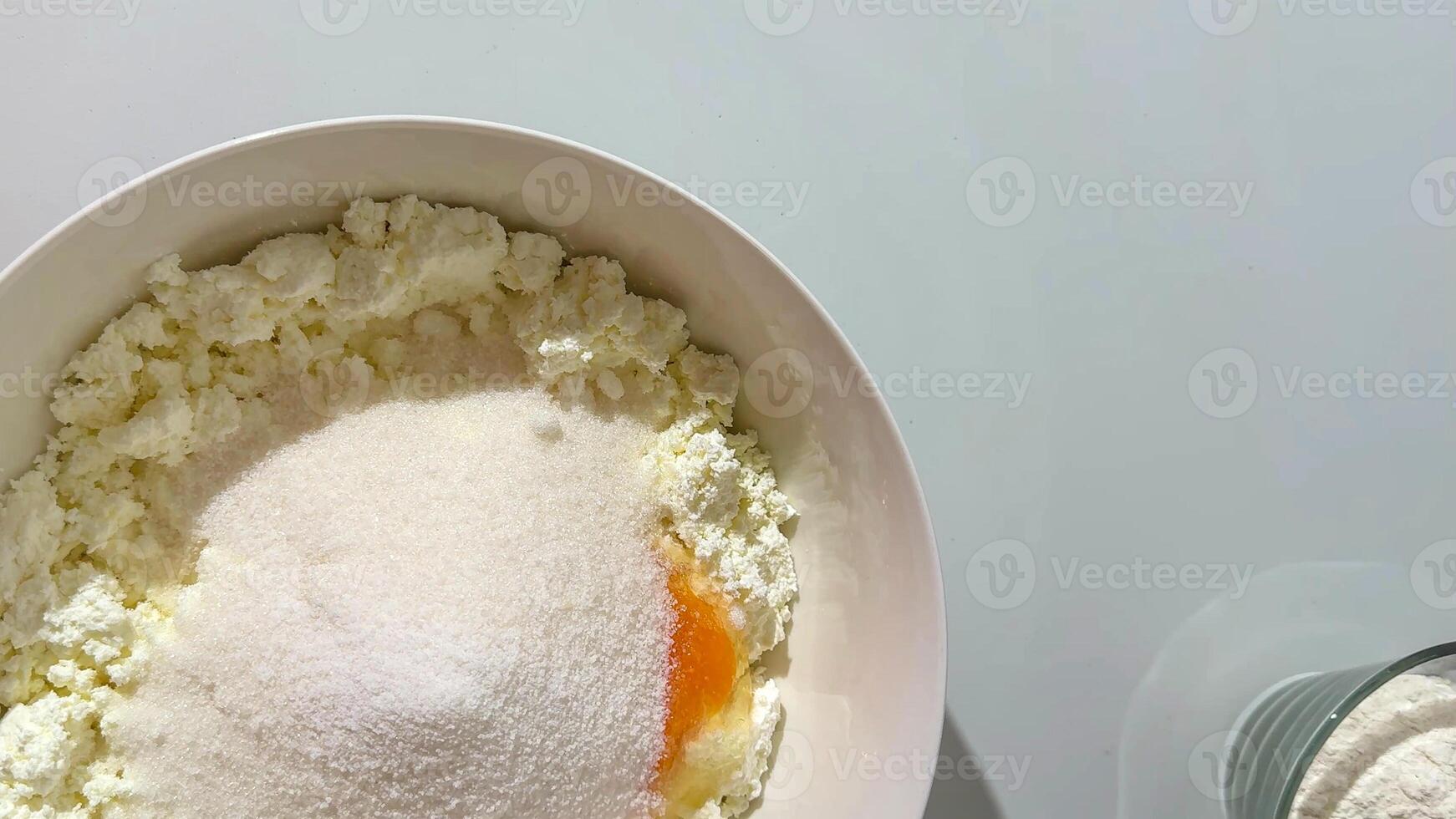 Baking preparation with flour, sugar, and egg in bowl, perfect for festive holiday cooking or Christmas recipes concept photo
