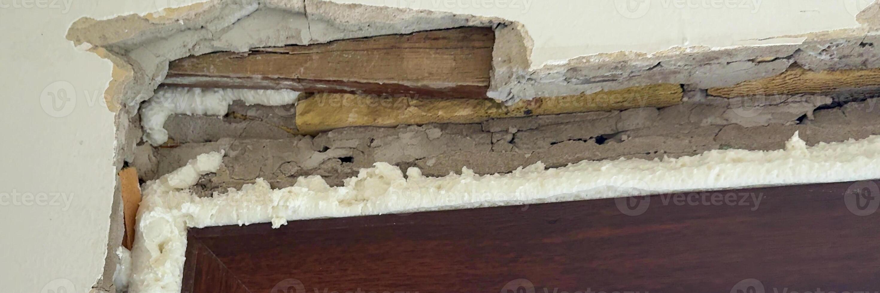 Damaged doorway plaster showcasing renovation challenges, home repair, maintenance issues, before and after transformation projects, DIY construction photo