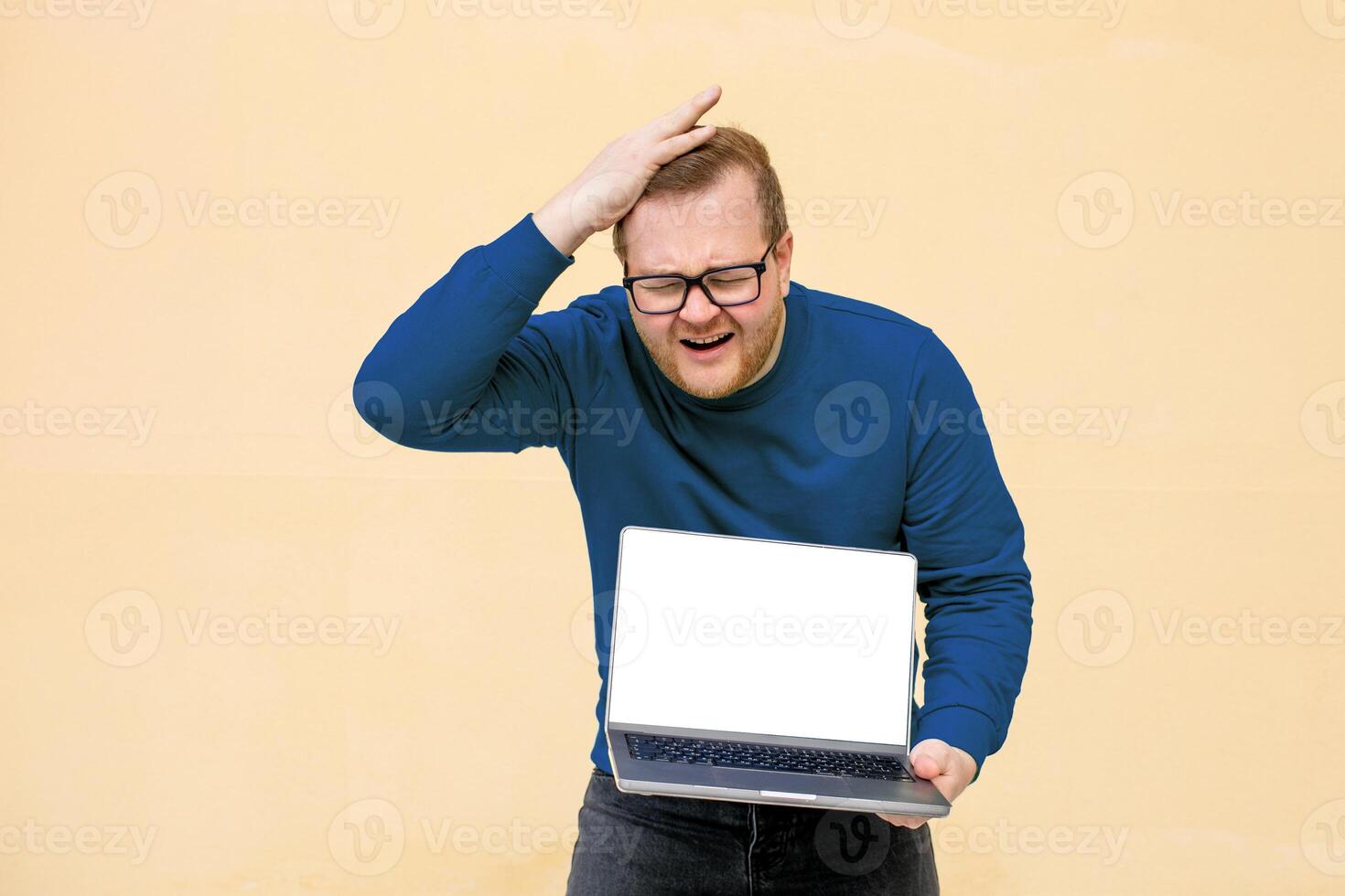 A perplexed Caucasian man furrowing brows over laptop, conjuring digital dilemmas, World Backup Day musings, pixelated conundrums, bewilderment aura photo
