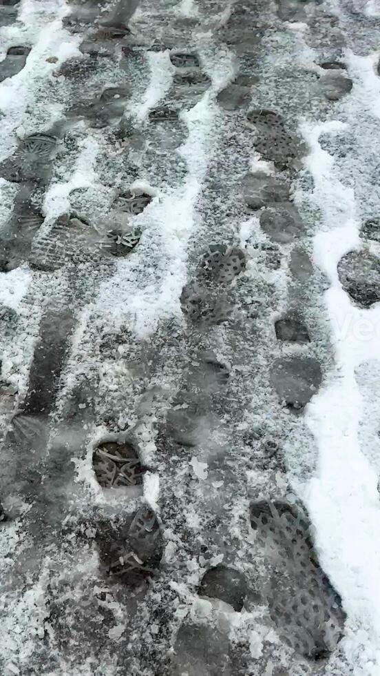 Footprints on a snowy path symbolize winter journey, holiday travels, outdoor adventure during Christmas and New Year celebrations photo