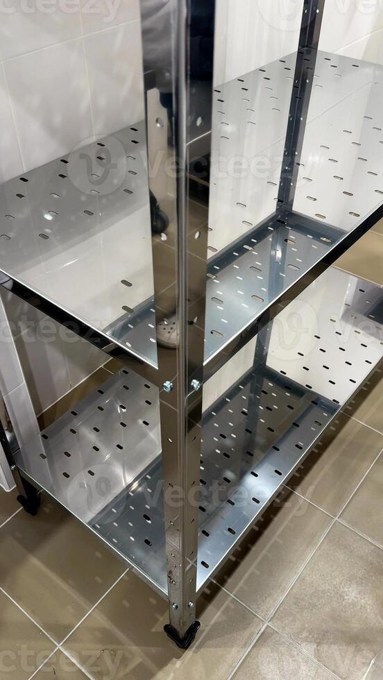 Stainless steel shelving unit in industrial setting, perfect for home organization, warehouse storage, sleek design, efficiency concepts photo
