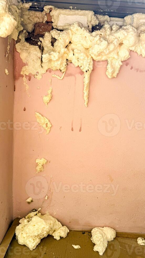 Foamy insulation chaos, resembling surreal marshmallow drips, invokes National Museum Day vibrant art underbelly, isolation and whimsy intertwined photo