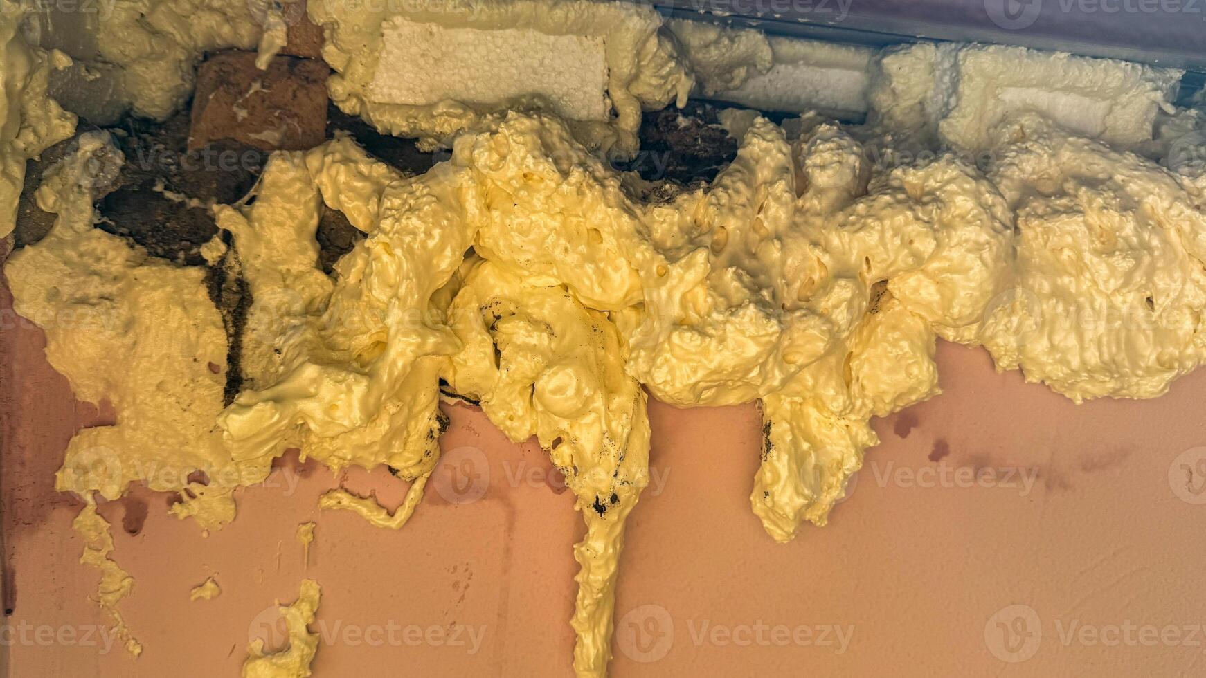 Foamy insulation chaos, like golden marshmallow lava, hints at DIY wizardry, perfect for World Creativity and Innovation Day photo