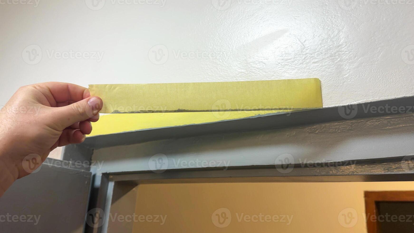 Hand measuring door height with ruler, showcasing home improvement, renovation projects, precise carpentry, and DIY craftsmanship skills photo
