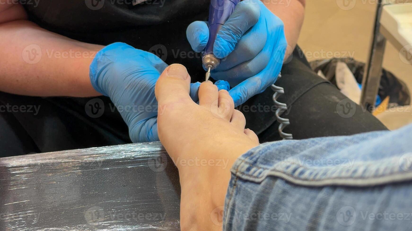 Caucasian female receiving pedicure foot care treatment, wellness and self care concept, spa day relaxation, perfect for Mothers Day photo