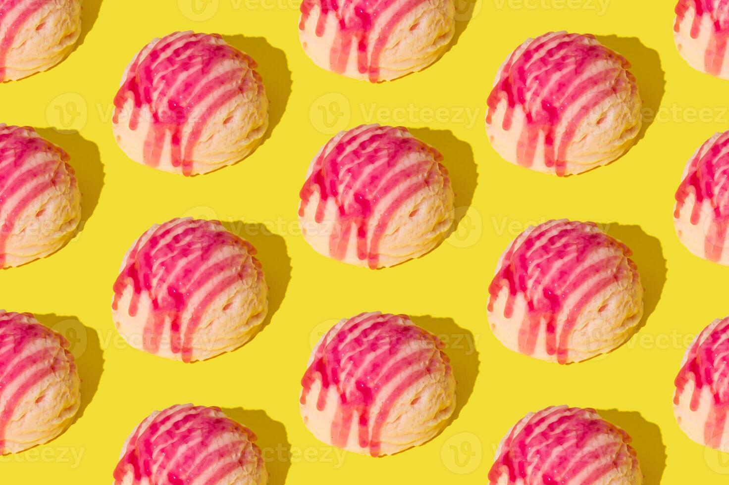 Pink strawberry ice cream pattern on yellow background. Summer food concept. Minimal isometric layout. Ice cream scoop aesthetic idea. photo