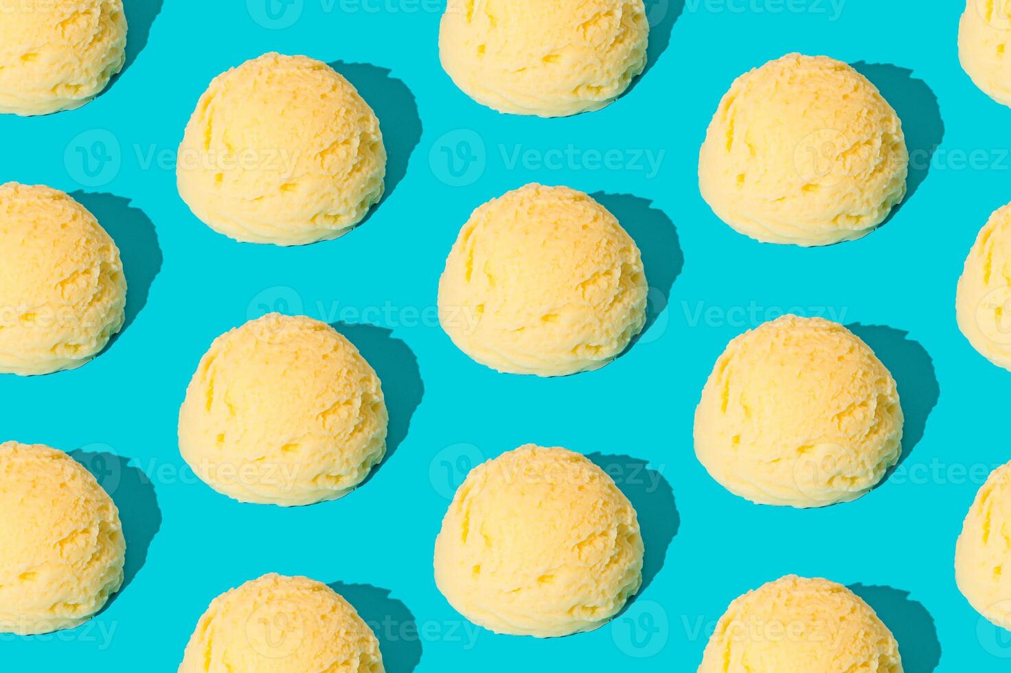 Vanilla ice cream pattern on pastel light blue background. Summer food concept. Minimal isometric layout. Ice cream scoop aesthetic idea. photo