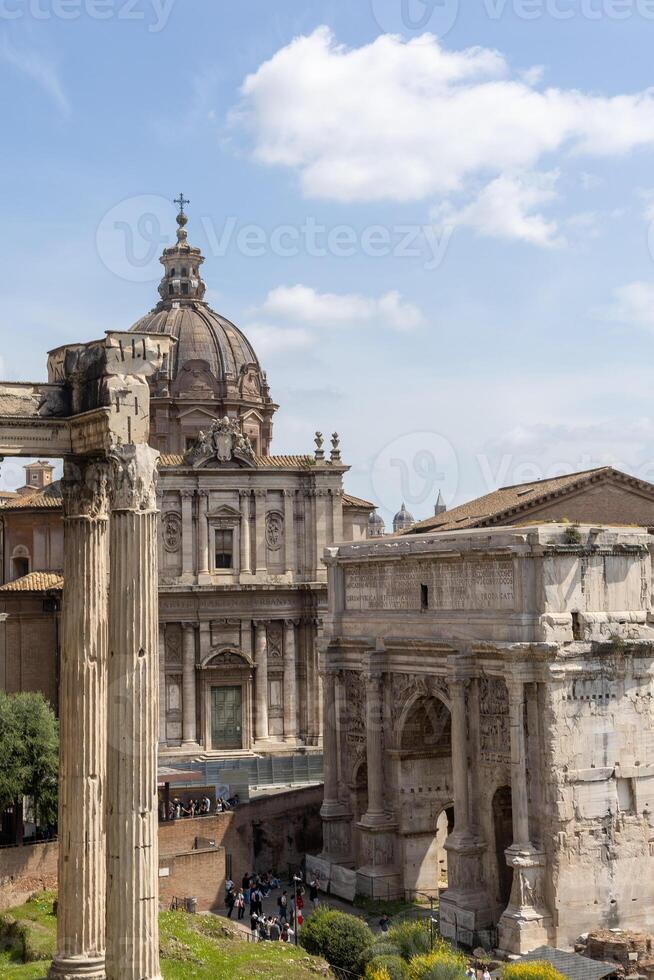 Exploring ancient ruins and majestic architecture in the heart of Rome on a sunny afternoon photo
