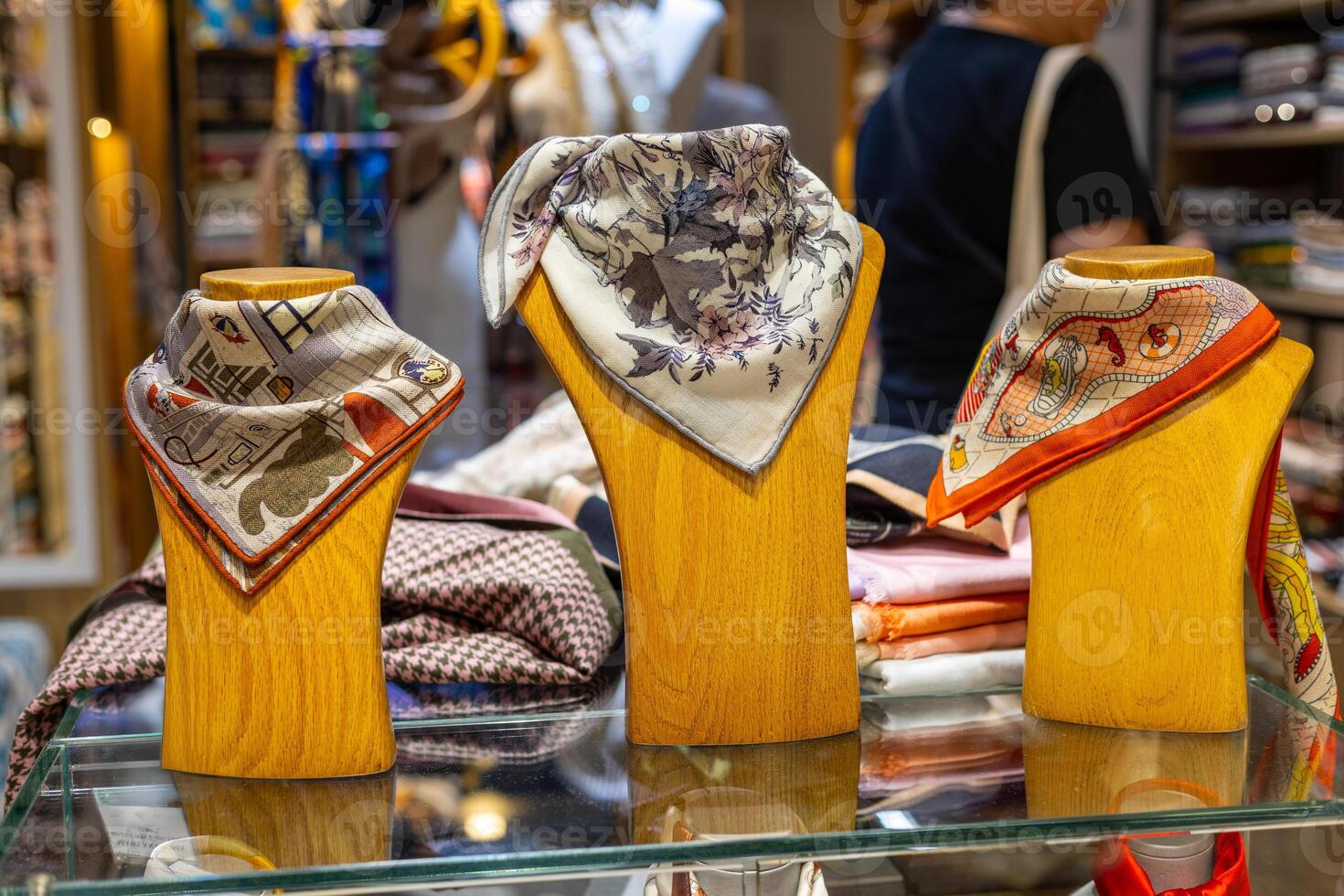 Stylish scarves displayed in a boutique showcasing intricate designs and vibrant colors photo