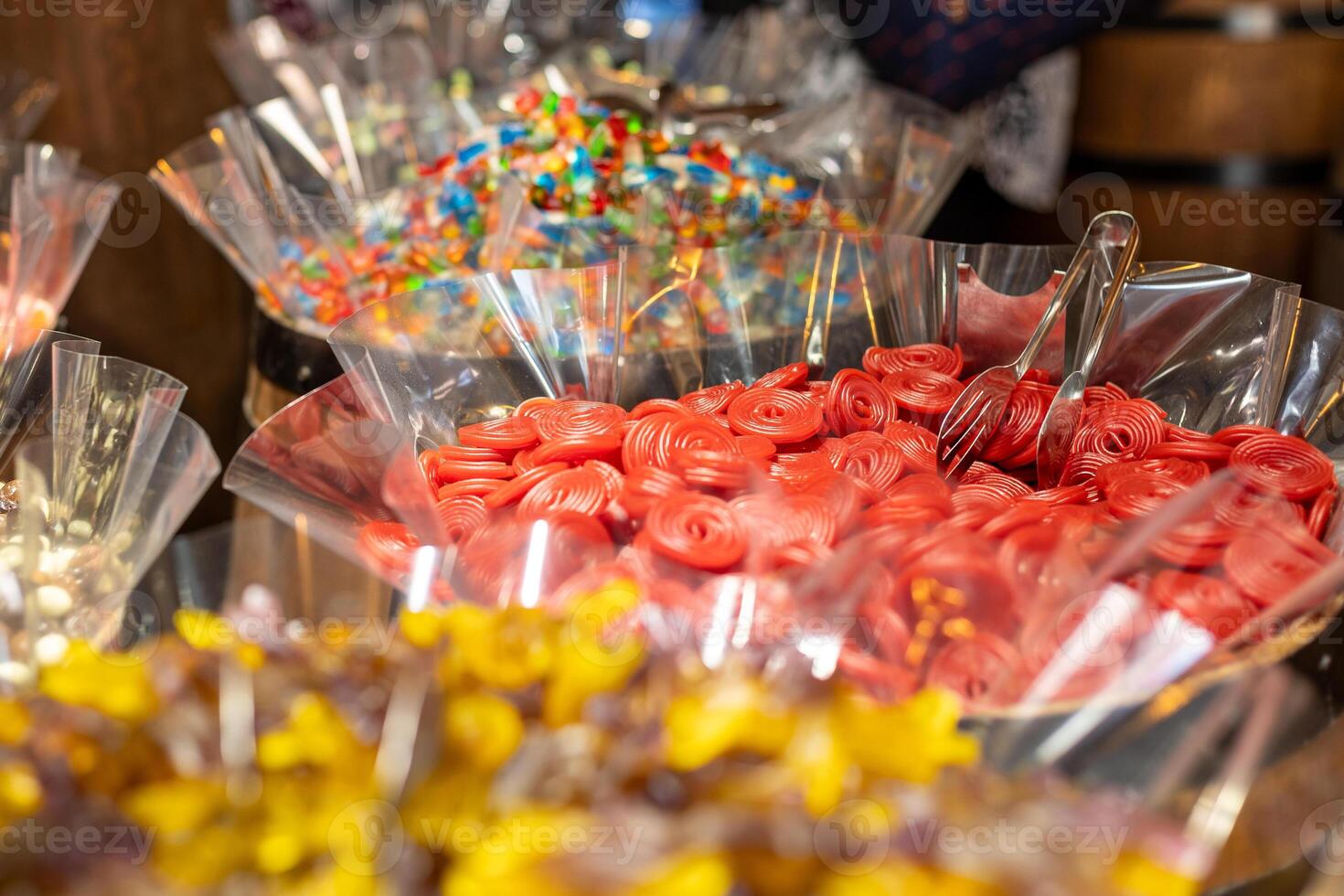 Colorful candy display at a bustling market showcasing various sweets and treats during an afternoon visit photo