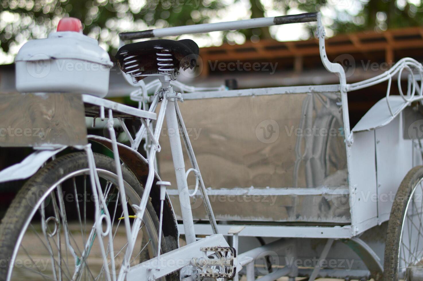 Retro style pedicab in daylight, showcasing Asian manual transport with charm. great for eco, vintage, or culture themed visuals. photo