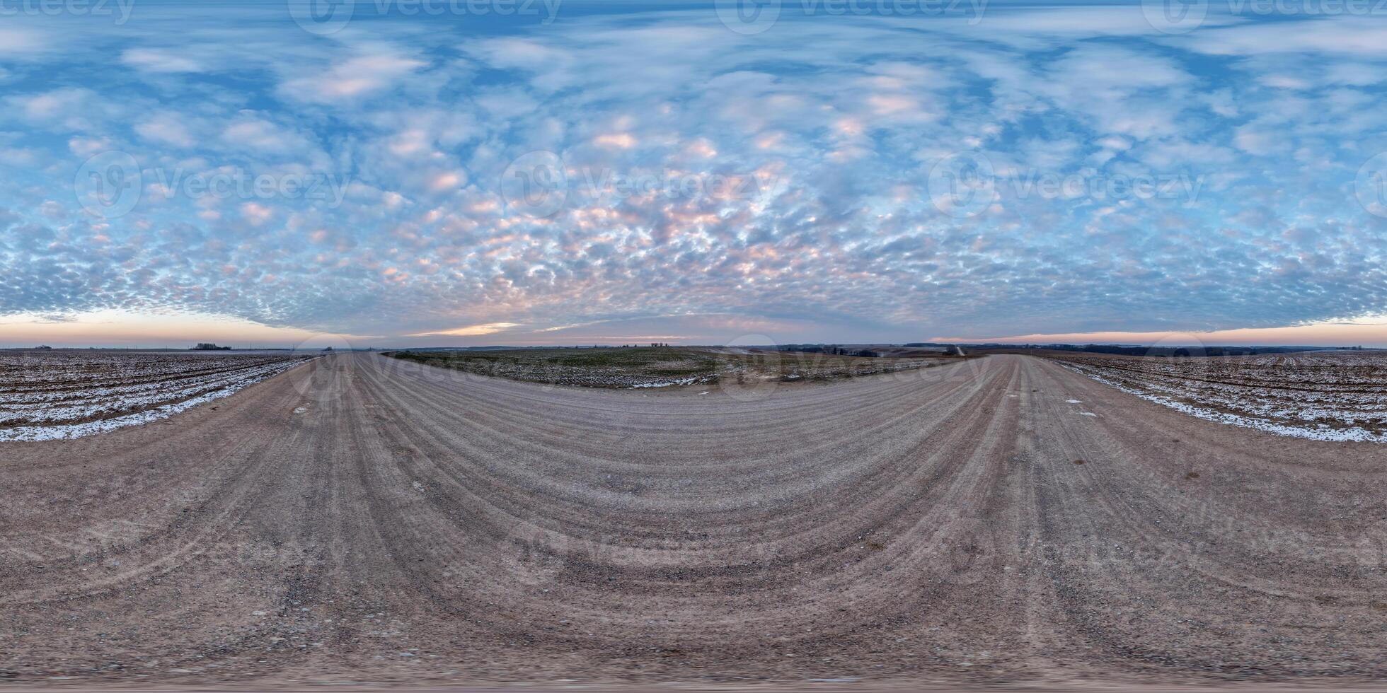 hdri 360 panorama on gravel road among farming fields with tire tracks with evening sky in equirectangular full seamless spherical projection, for VR AR virtual reality content photo