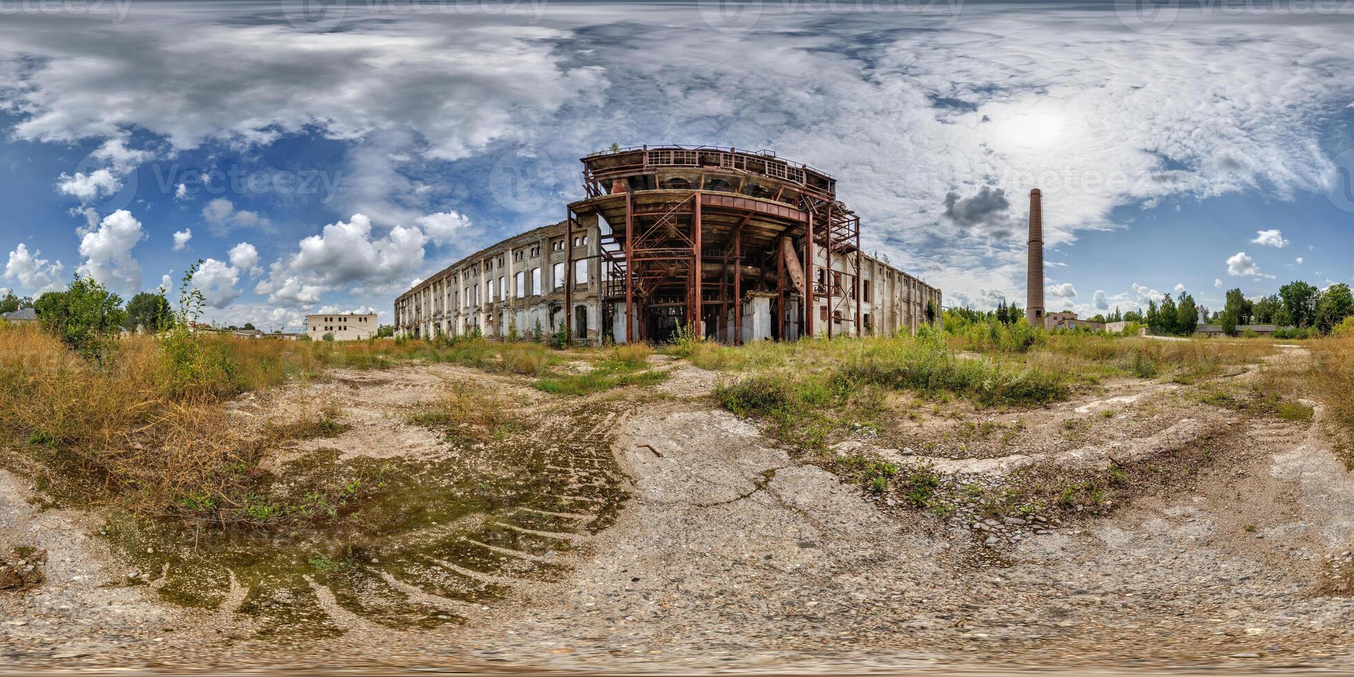 An old abandoned building in a field photo