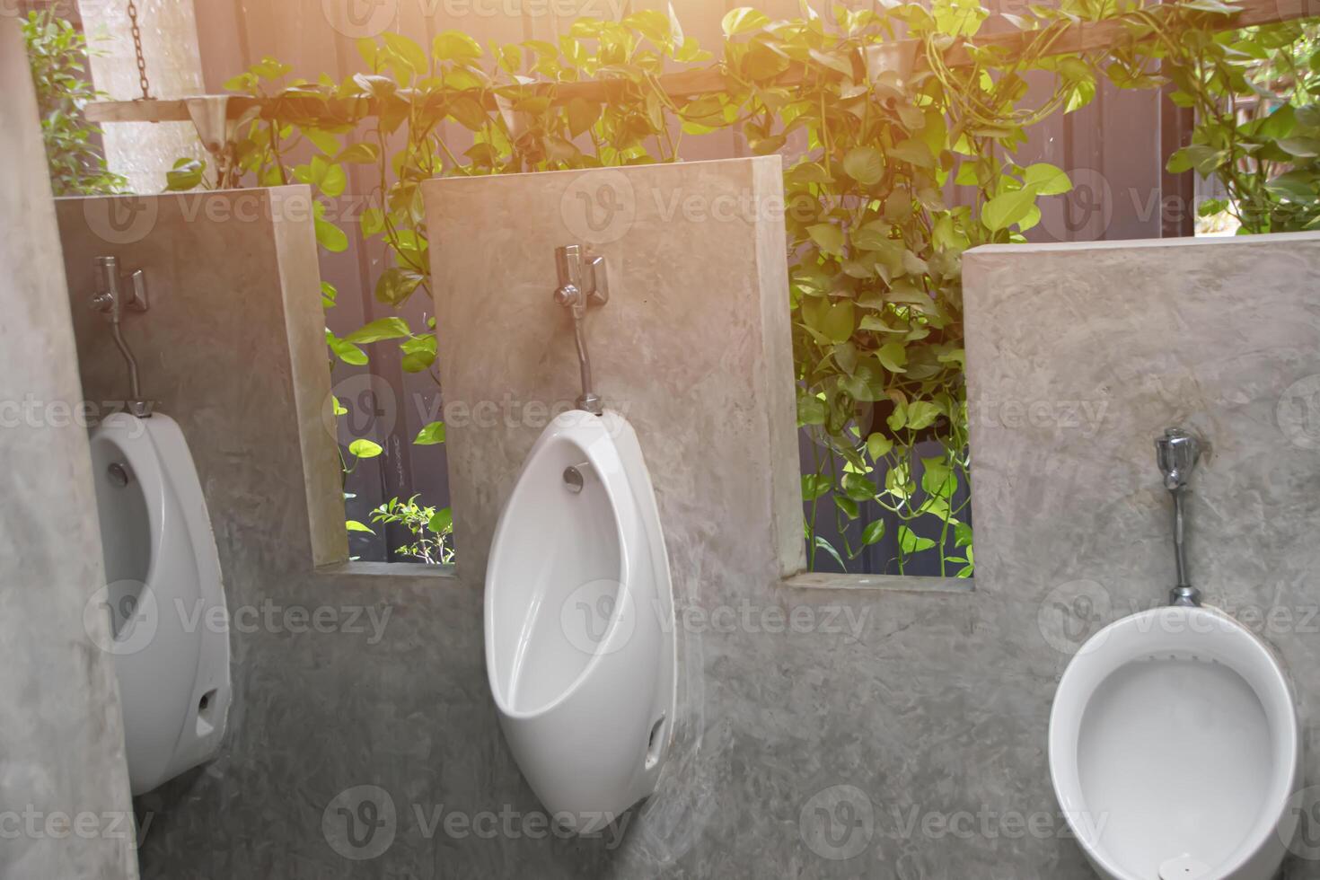 Male urinal, men's bathroom, decorated in a loft style photo