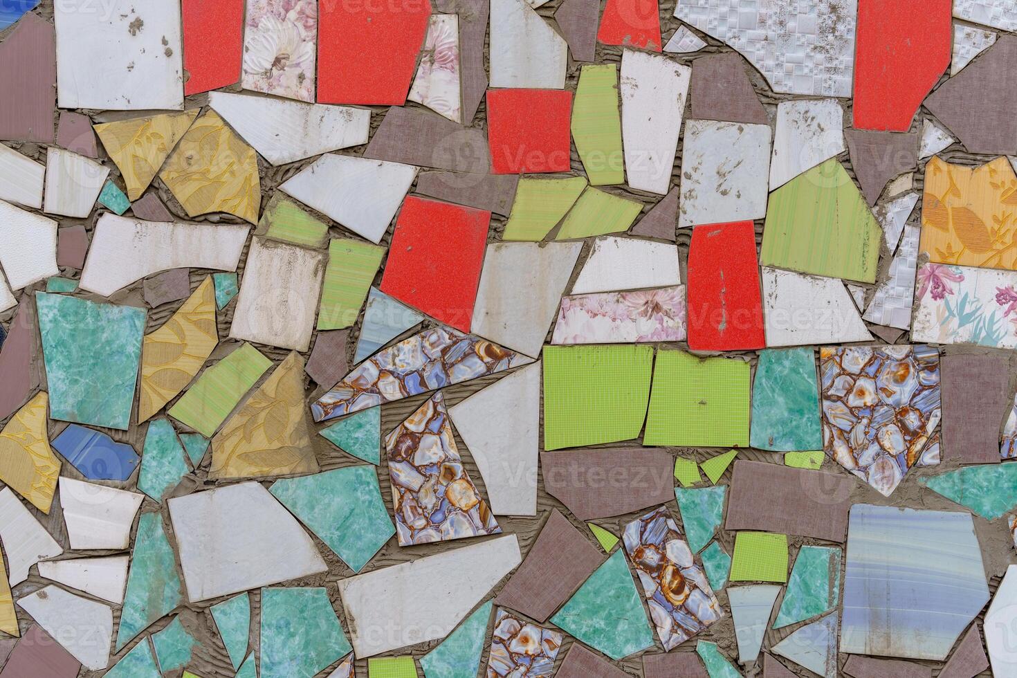 Mosaic of multicolored pieces of broken tiles. Abstract background. photo