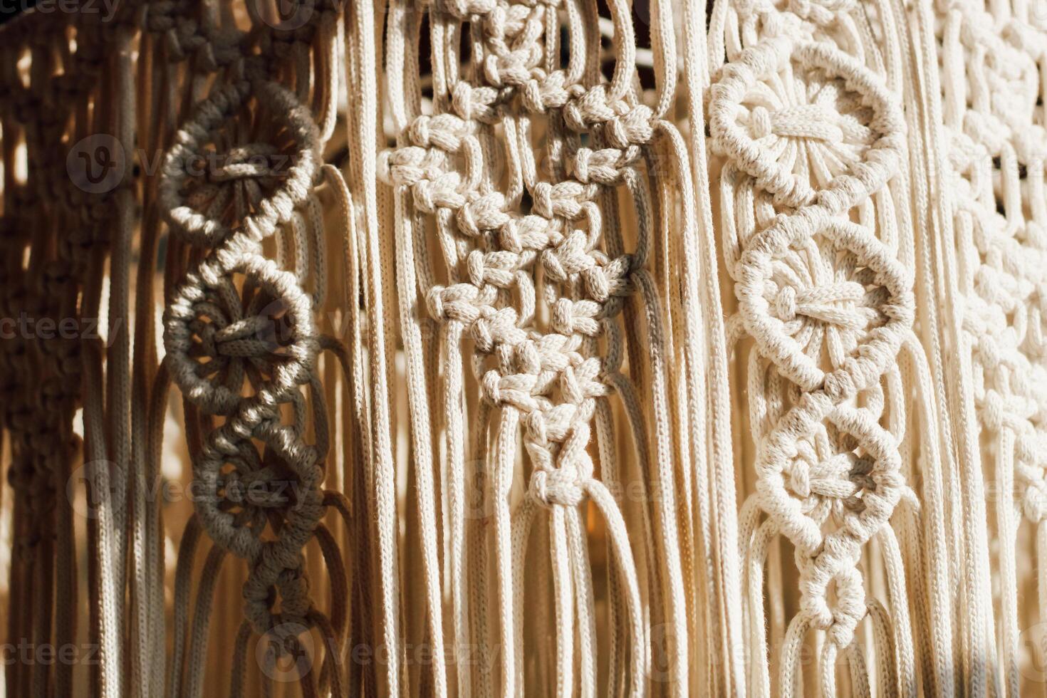 Intricate macrame design showcasing craftsmanship and artistic expression in warm sunlight photo