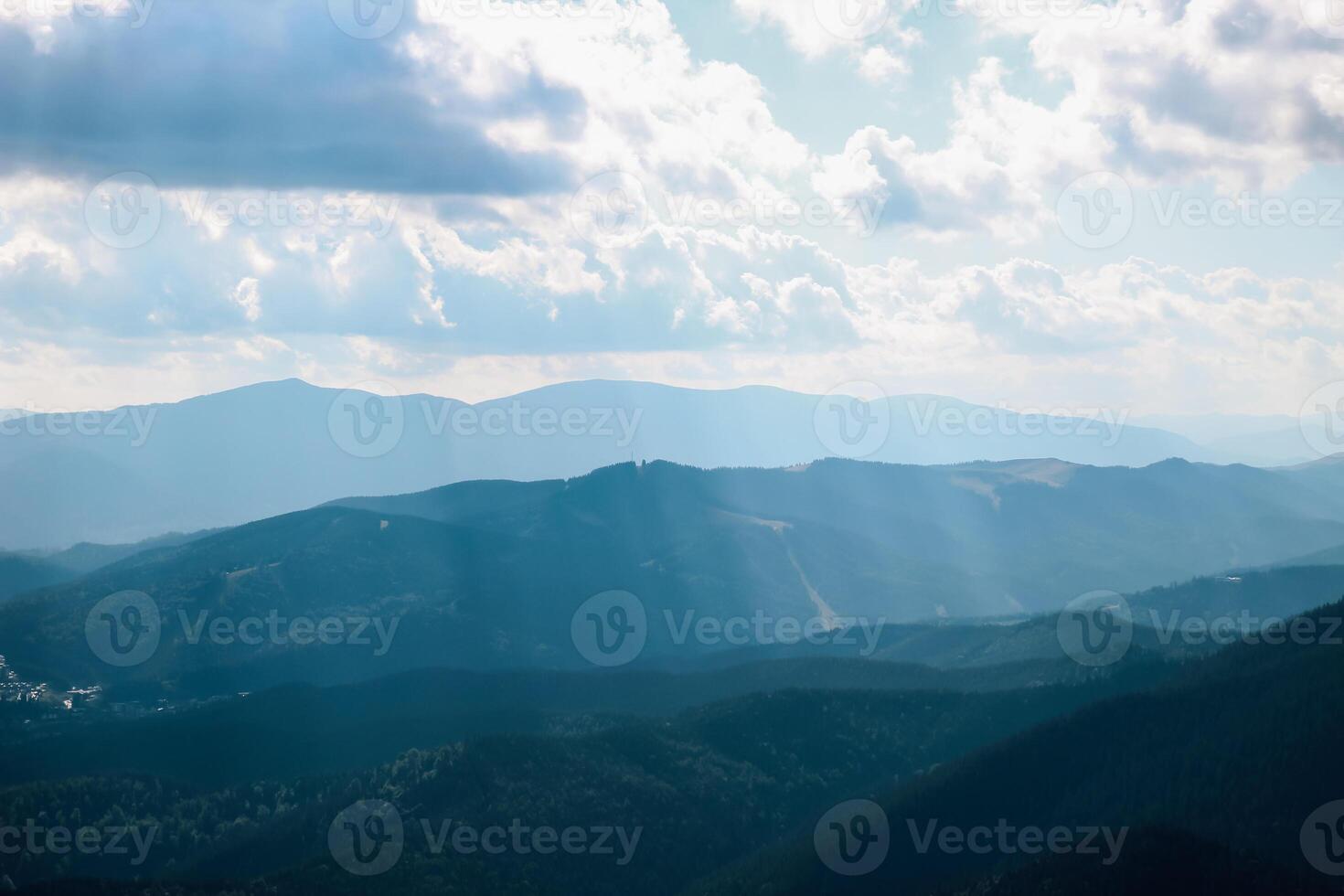 Mountains and clouds create a breathtaking vista at dusk over valley landscapes photo