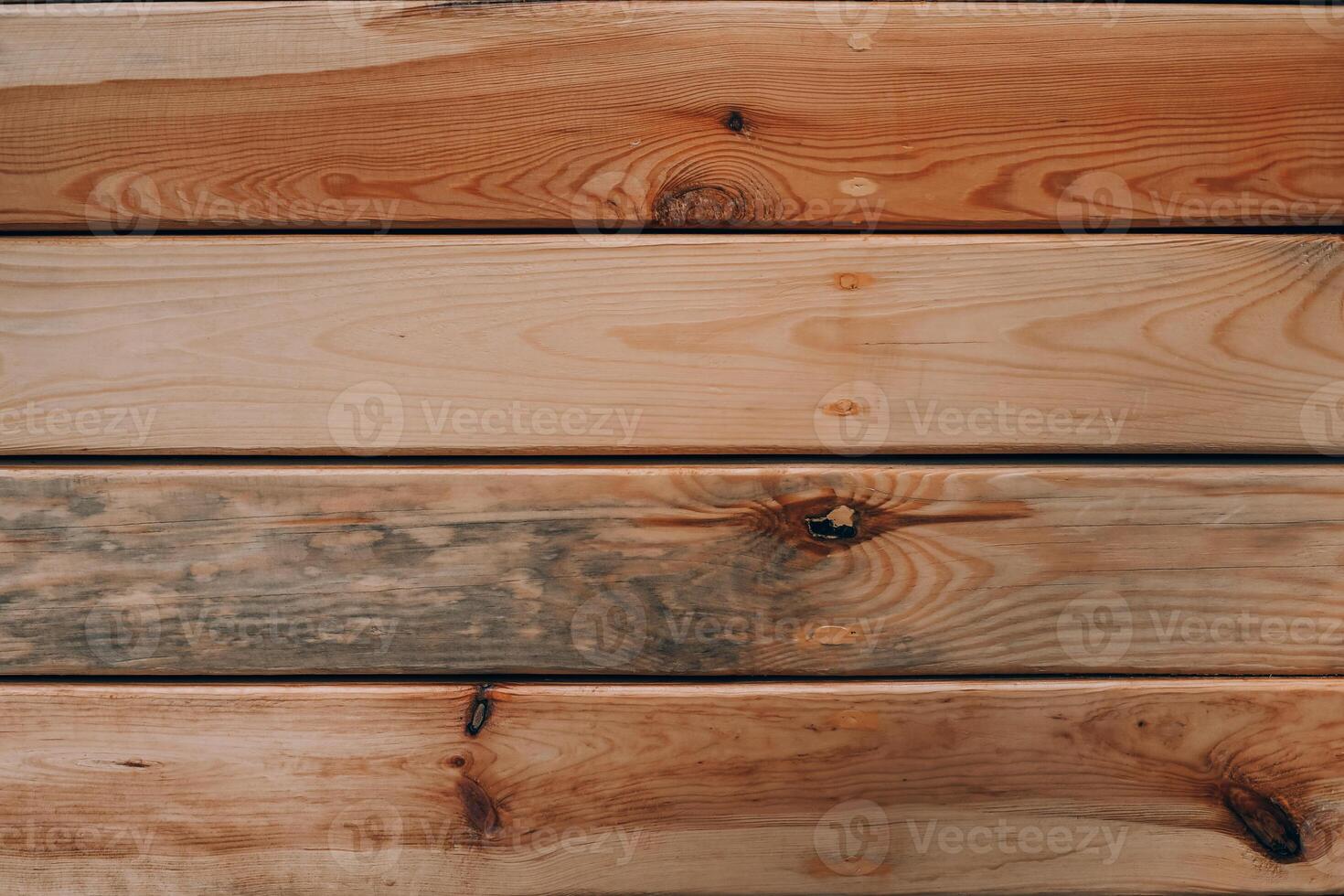 Wooden planks arranged in a natural pattern showcasing grain and color variations photo